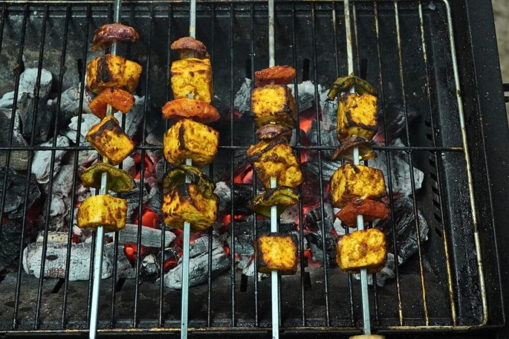 BBQ Grilled Paneer Tikka ready on charcoal grill