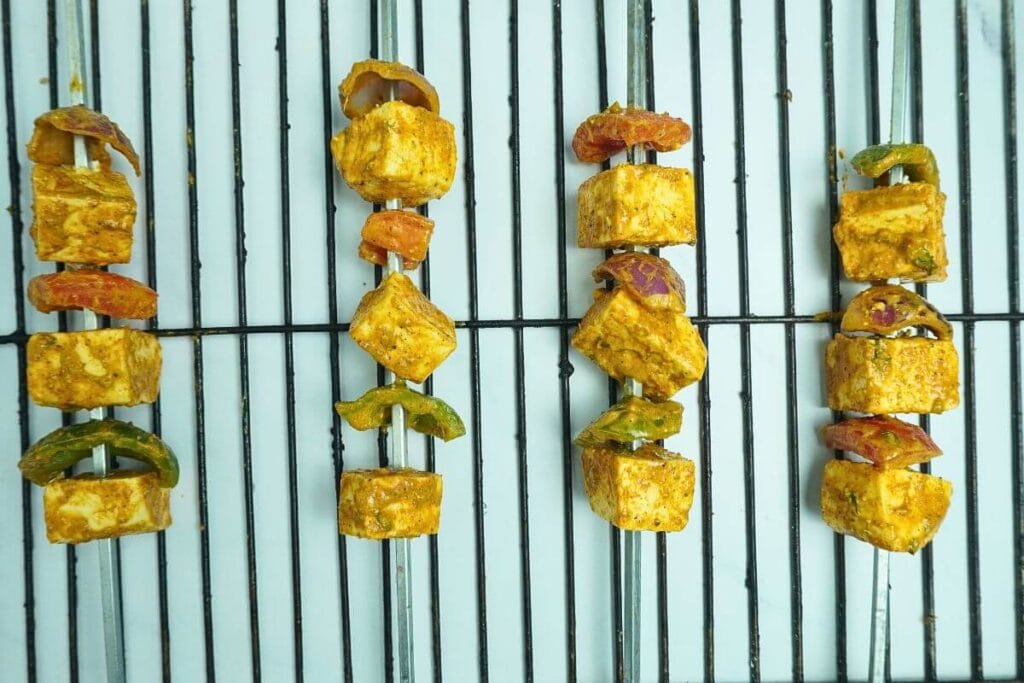 BBQ Grilled Paneer Tikka thrading in skewers