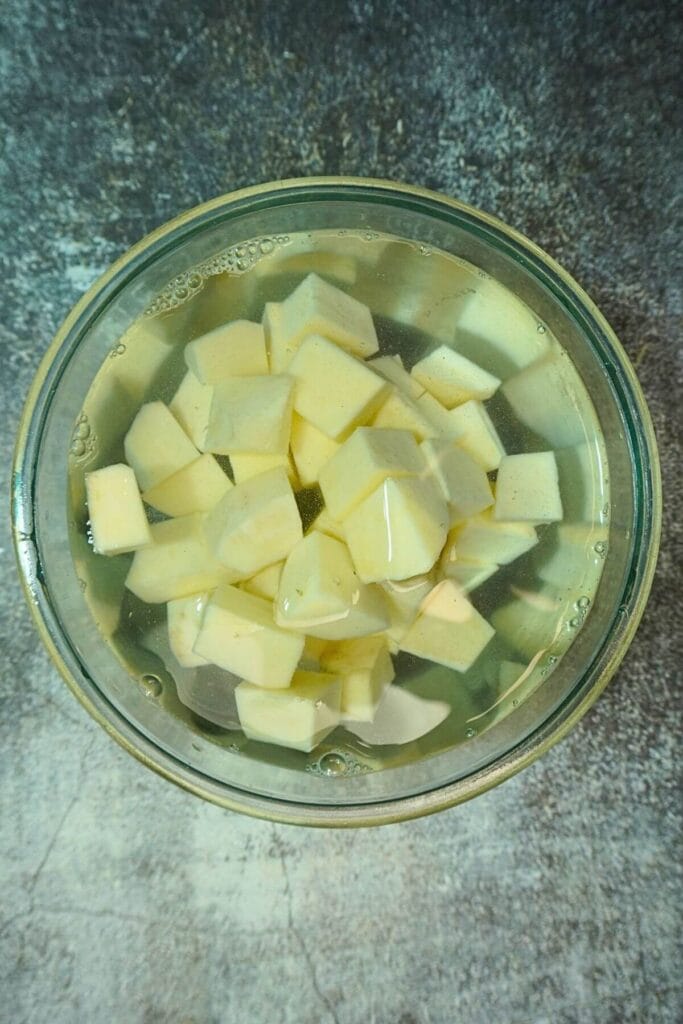 sweet potato diced in airfryer soak in water