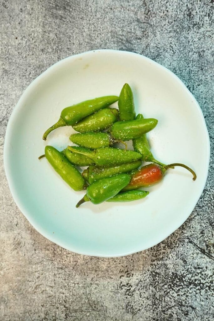 roasted green chilli in grill add spices