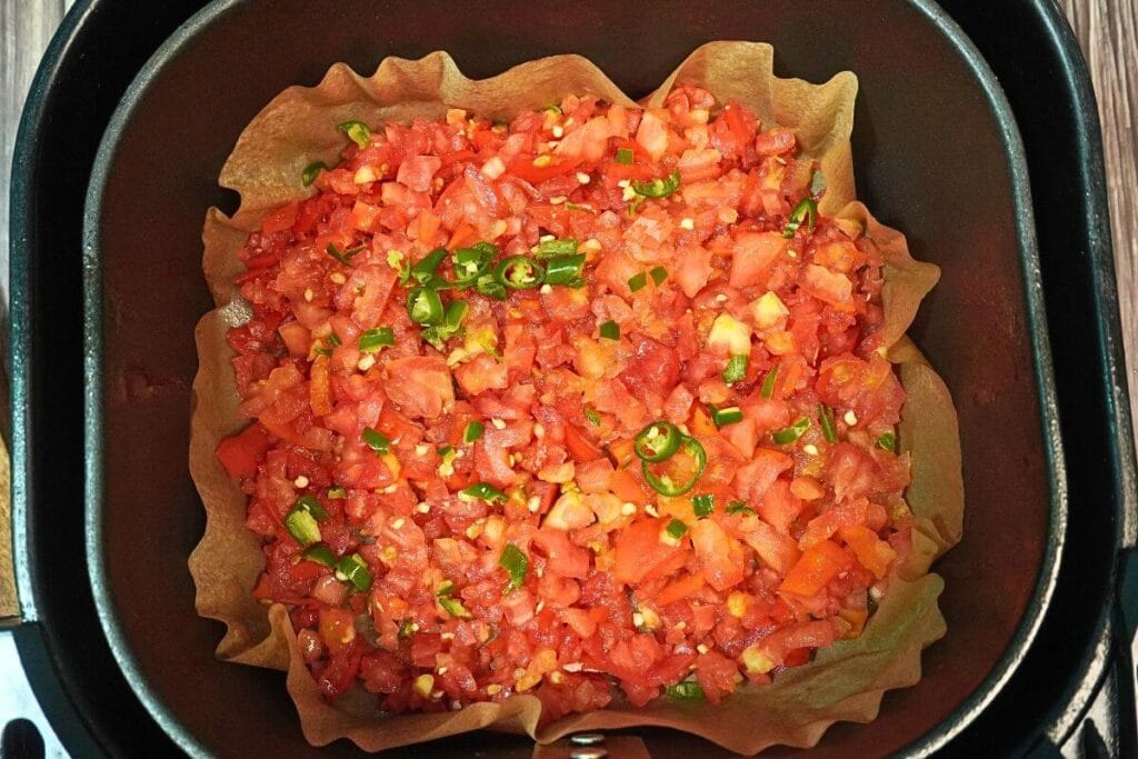 egg shakshuka in airfryer add chooped tomatoes and chilli
